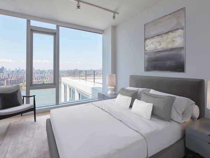 a hotel room with a bed and a large window