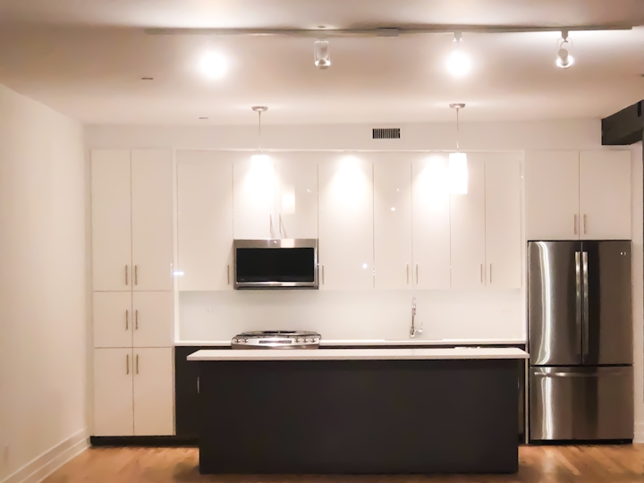 a modern kitchen with stainless steel appliances