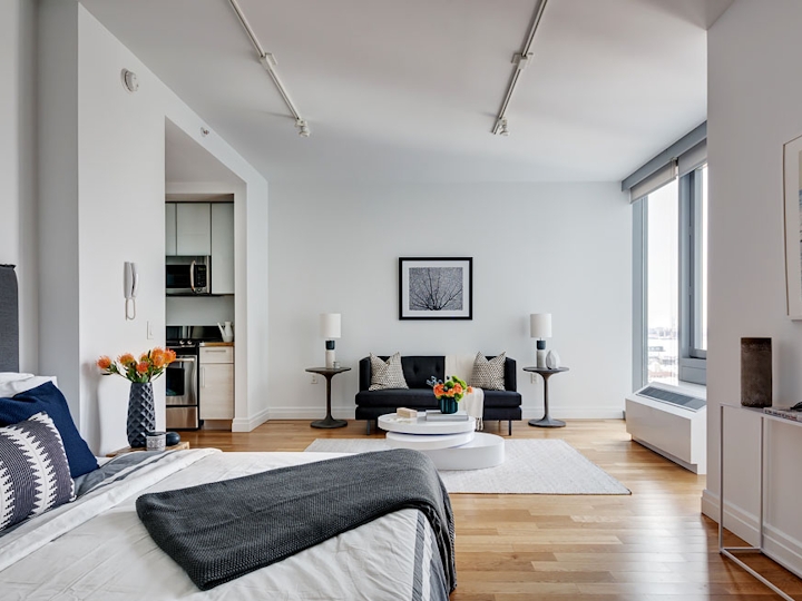 a bedroom with a large bed in a room