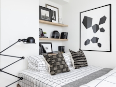 Thumbnail of The Ashland: 39J a bedroom with a bed and desk in a room