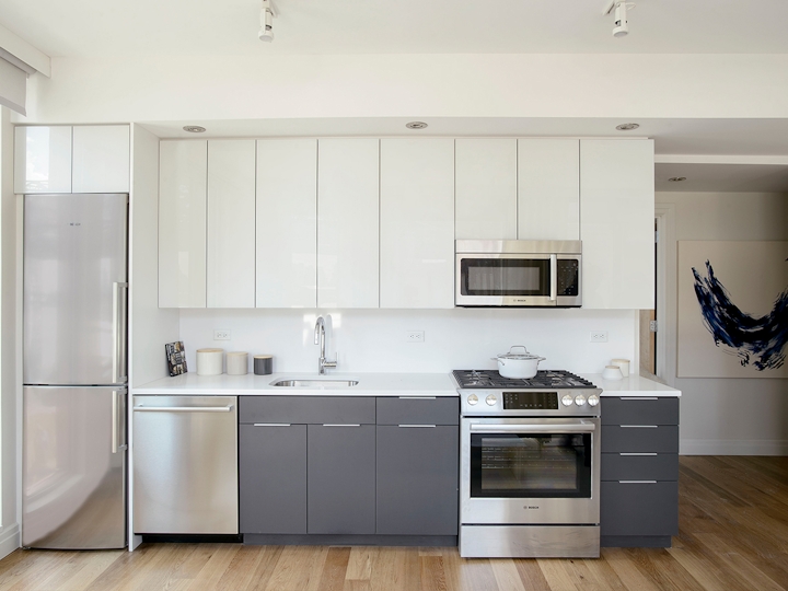 a large white refrigerator in a kitchen