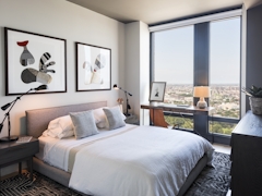 Thumbnail of The Ashland: 38N a bedroom with a large bed in a hotel room