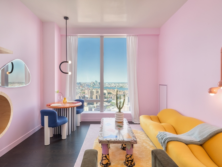 a bedroom with a bed and a chair in a room