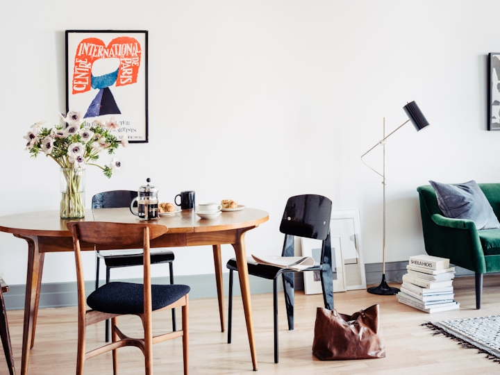 a living room filled with furniture and a table