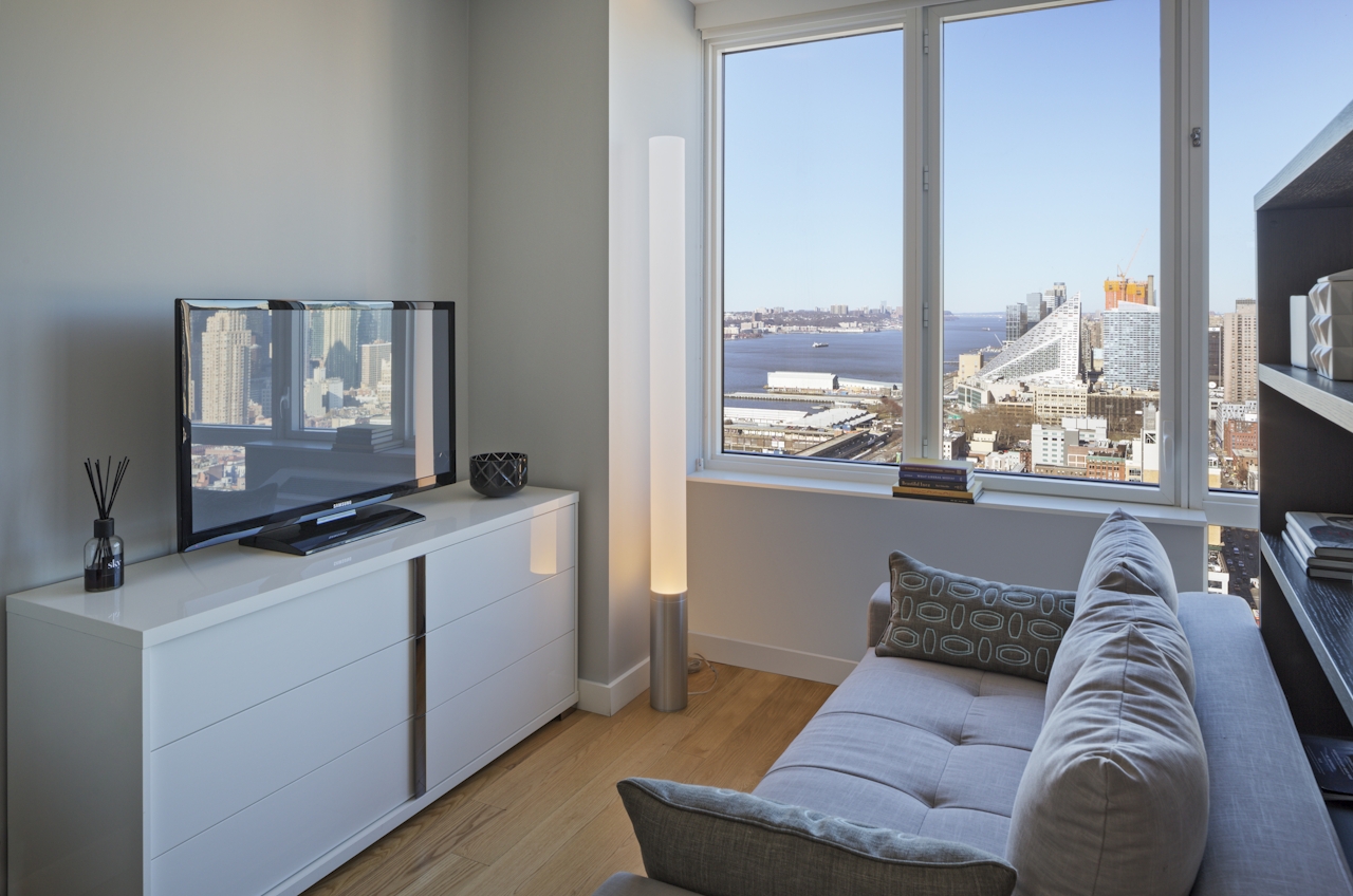 a view of a living room with a large window