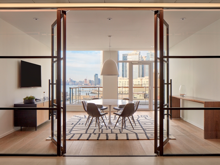 a room filled with furniture and a large window