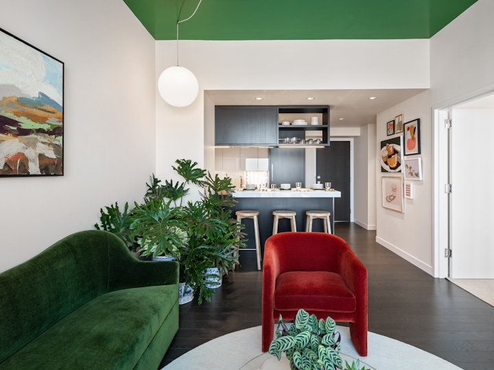 a living room filled with furniture and a flat screen tv