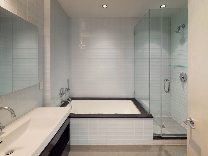 a room with a sink and a mirror