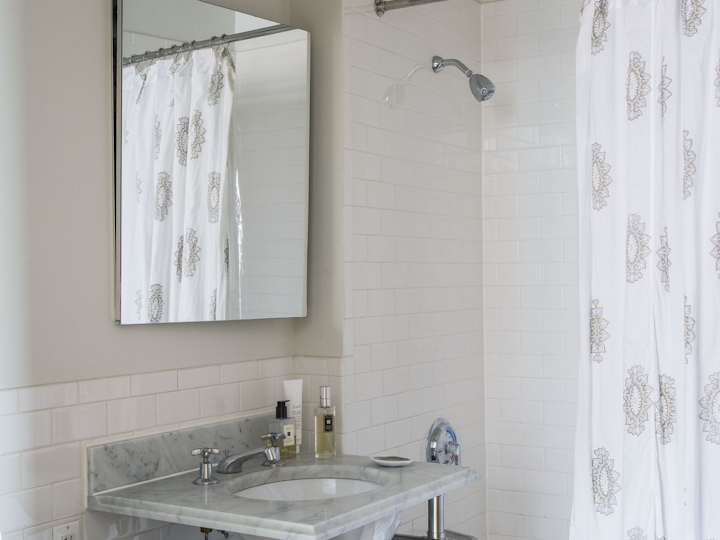 a room with a sink and a mirror