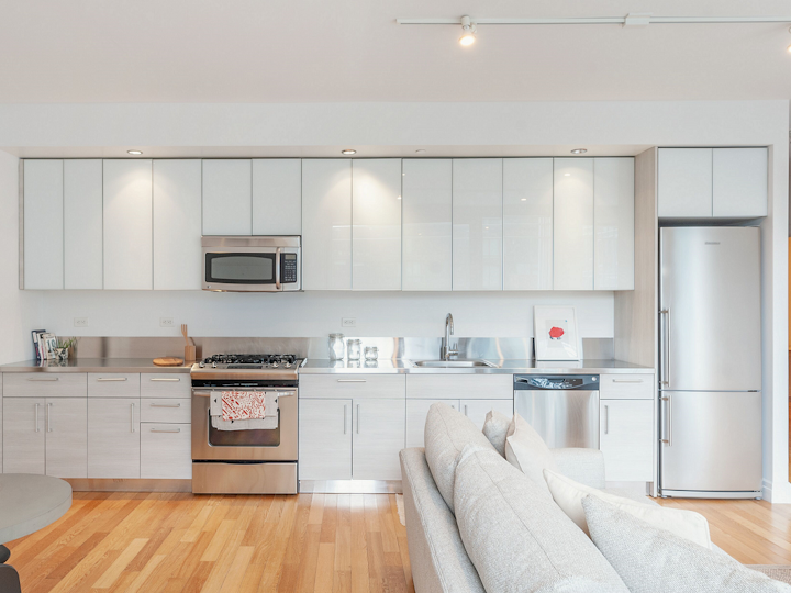 a modern kitchen with stainless steel appliances