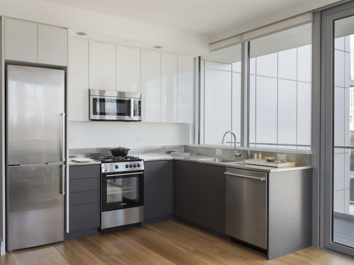 a large kitchen with stainless steel appliances