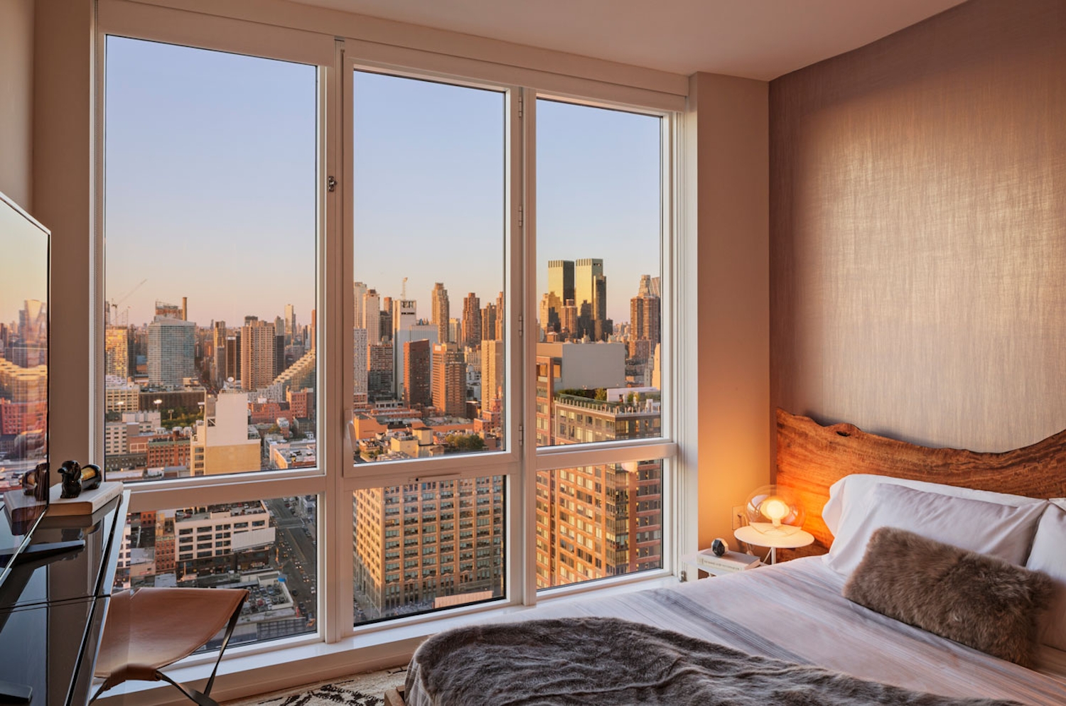 a bedroom with a large window