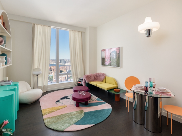 a living room filled with furniture and a flat screen tv