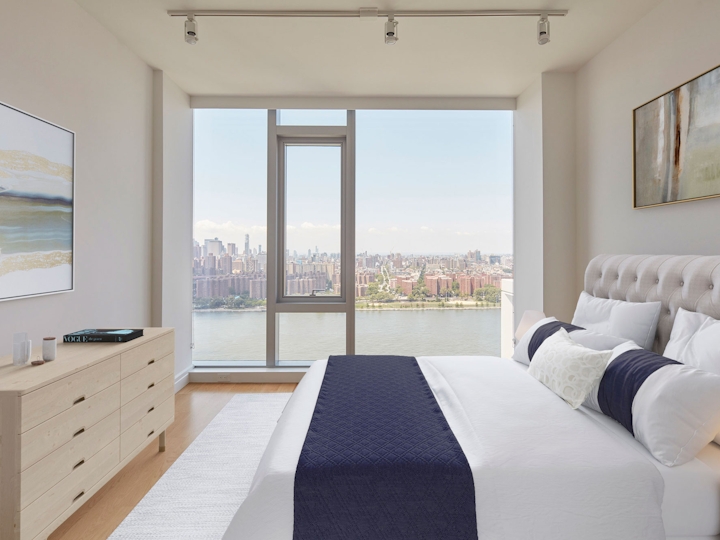 a bedroom with a large bed in a hotel room