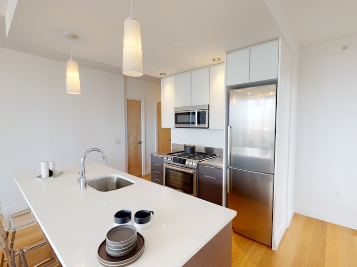 a modern kitchen with stainless steel appliances