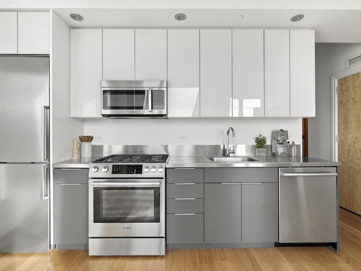 a kitchen with a stove top oven sitting inside of a refrigerator