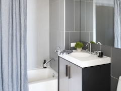 Thumbnail of The Ashland: PH2D a white tub sitting next to a shower curtain