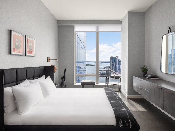 a large white bed in a room