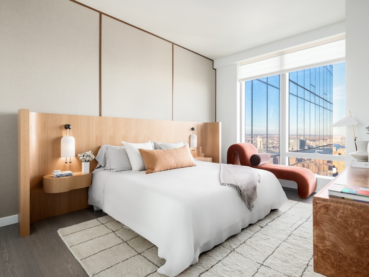 a bedroom with a large bed in a hotel room