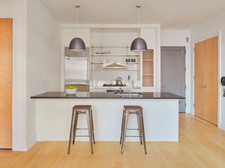 a kitchen with a wood floor