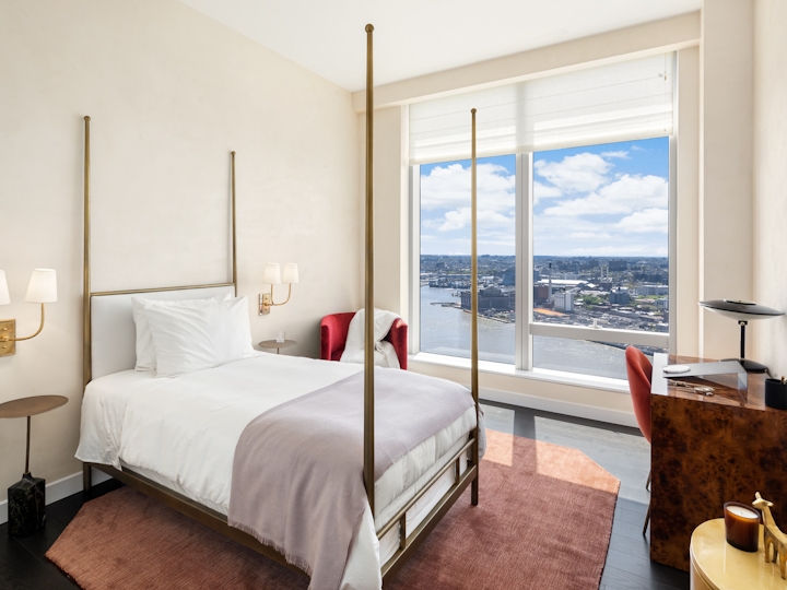 a bedroom with a large bed in a hotel room