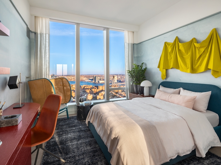 a bedroom with a large bed in a hotel room