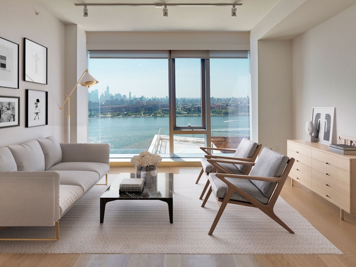 a view of a living room filled with furniture and a large window