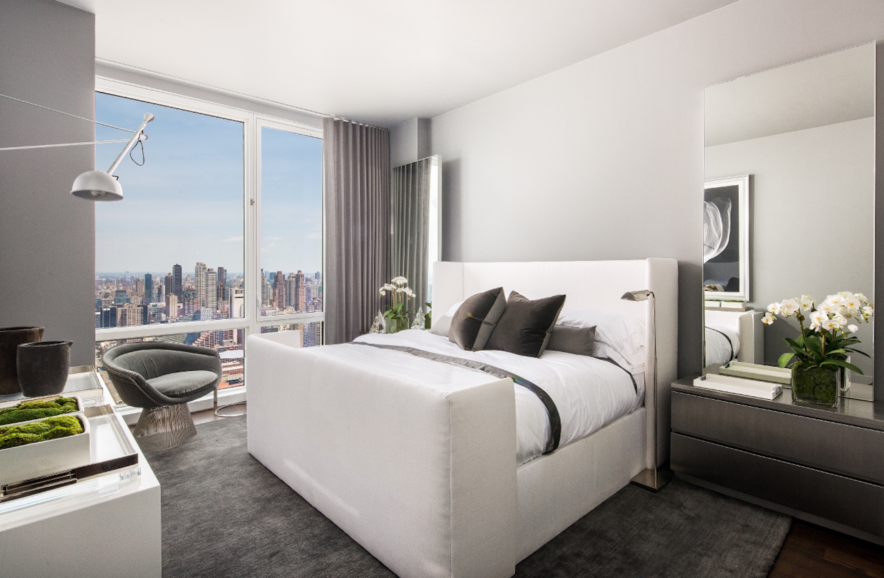 a bedroom with a large bed in a room