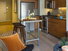 Thumbnail of Gotham West: 2204 a kitchen with a dining room table