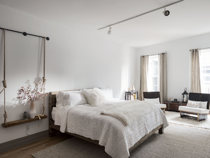 a bedroom with a large bed in a hotel room