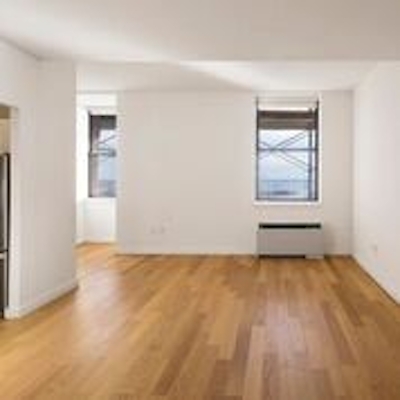 a large empty room with a hard wood floor