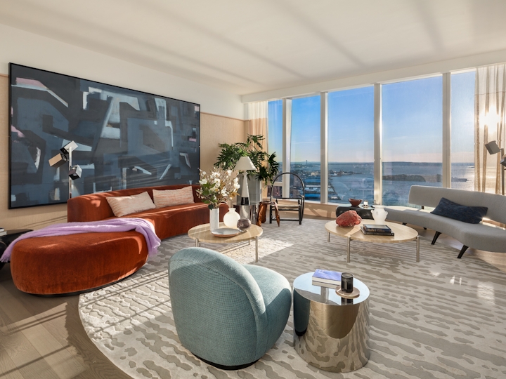 a living room filled with furniture and a large window