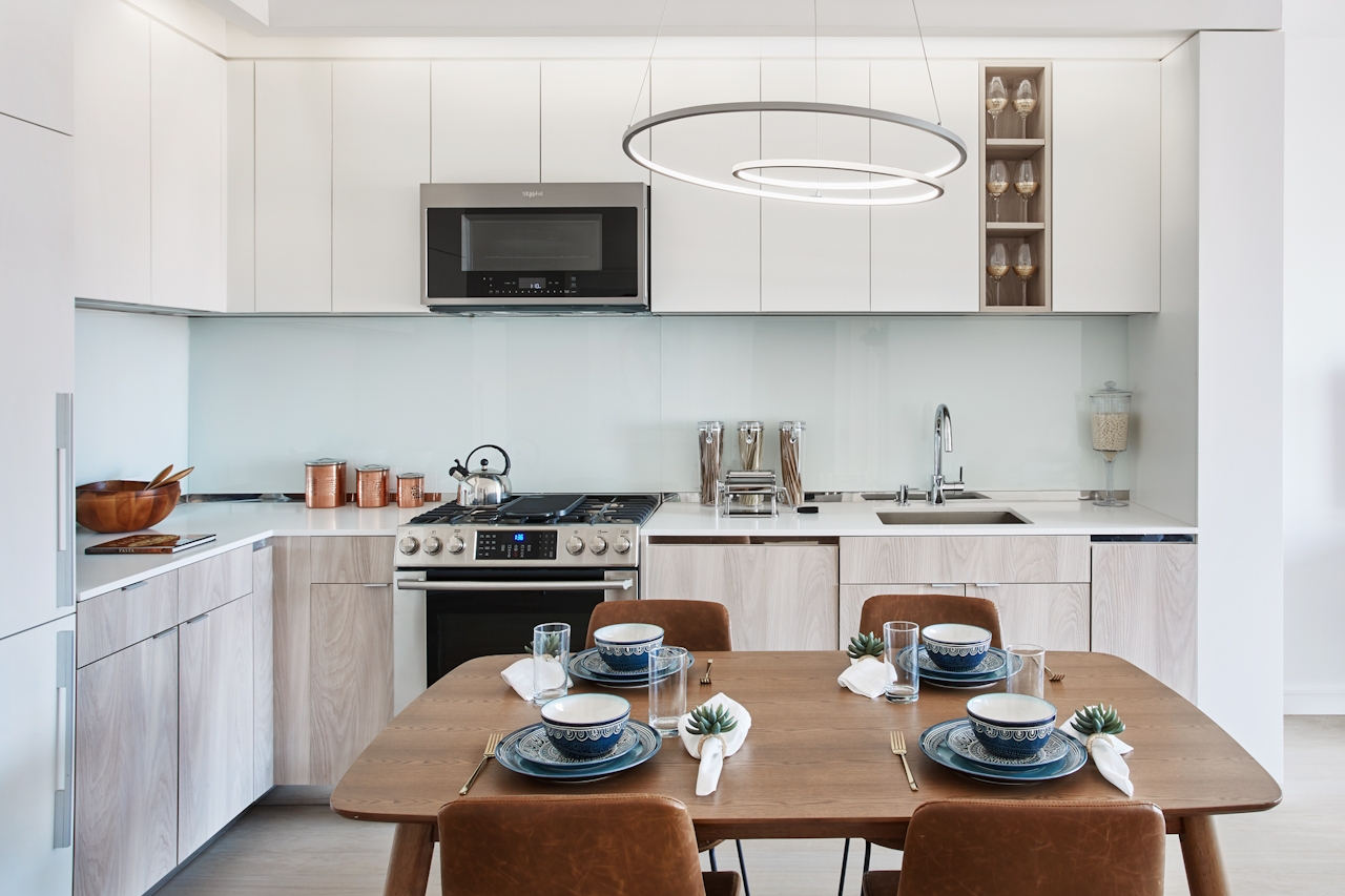 a kitchen with a table in a room