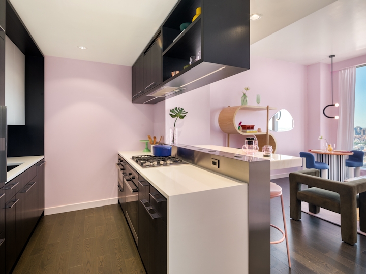 a kitchen with a sink and a mirror