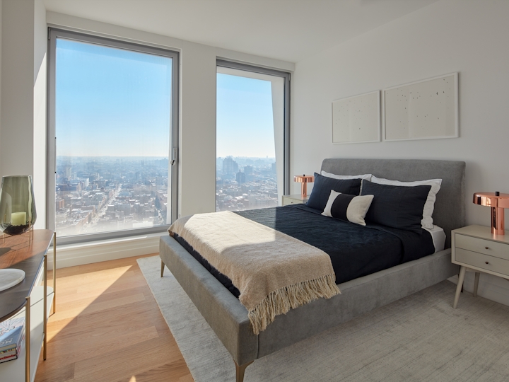 a hotel room with a bed and a large window