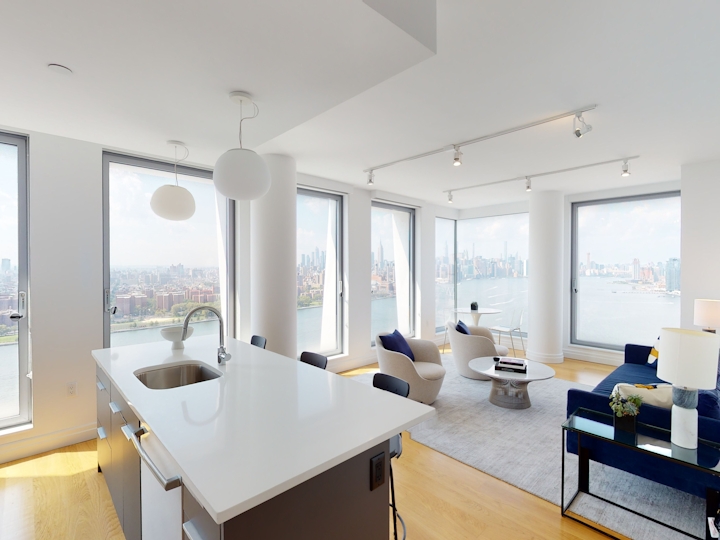a view of a living room with a sink and a window