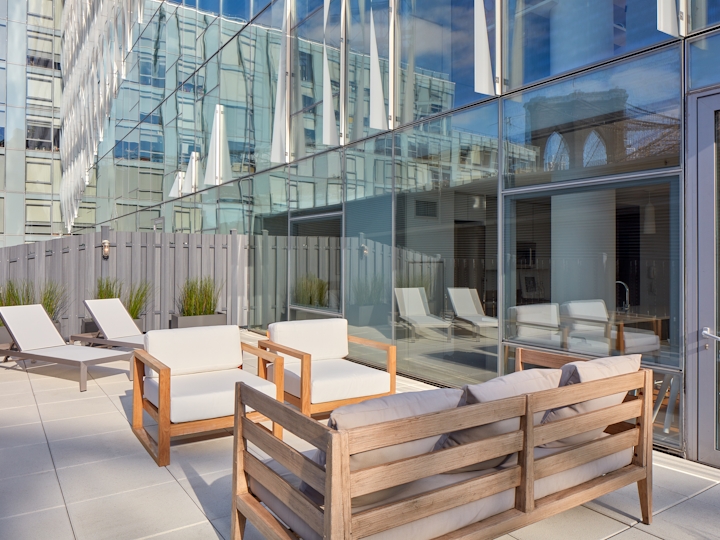 a chair sitting in front of a building