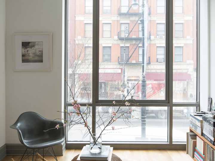 a living room filled with furniture and a large window