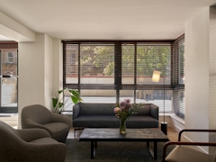 Thumbnail of The Nicole: 4K a living room filled with furniture and a large window