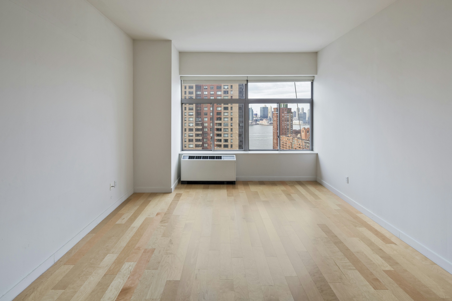 a large empty room with a wooden floor