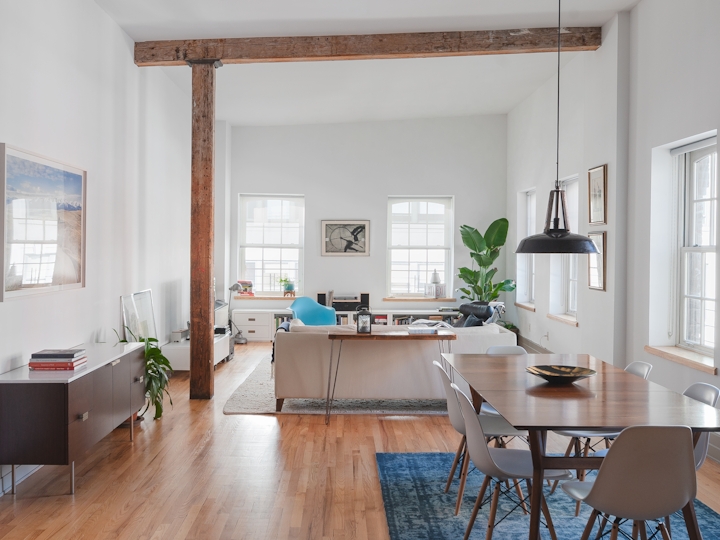 a dining room table in front of a window