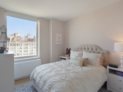 Thumbnail of Gotham West: 1906 a bedroom with a bed and desk in a room