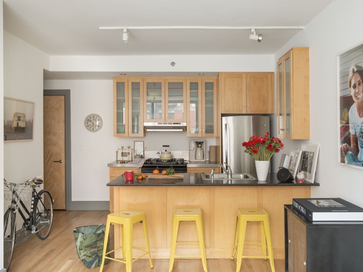 a kitchen filled with lots of furniture