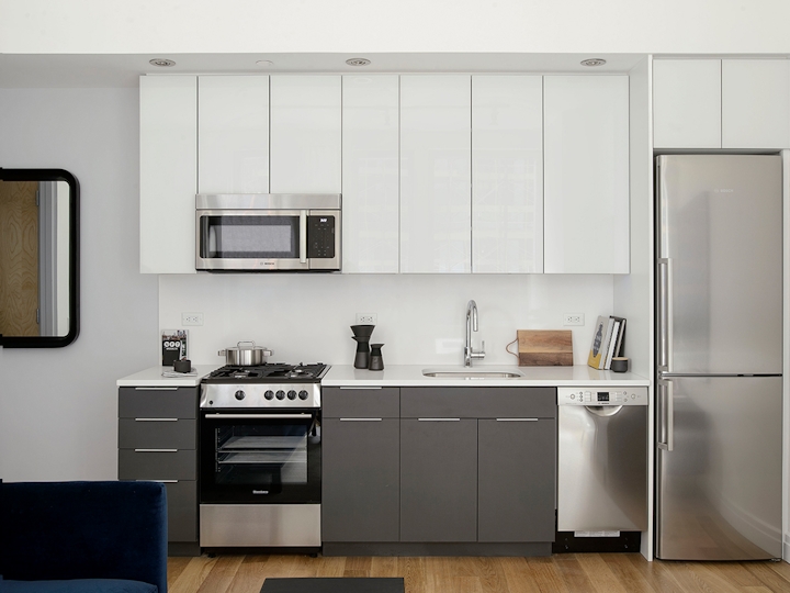 a kitchen with a sink and a microwave