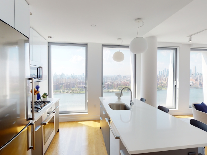 a room filled with furniture and a large window