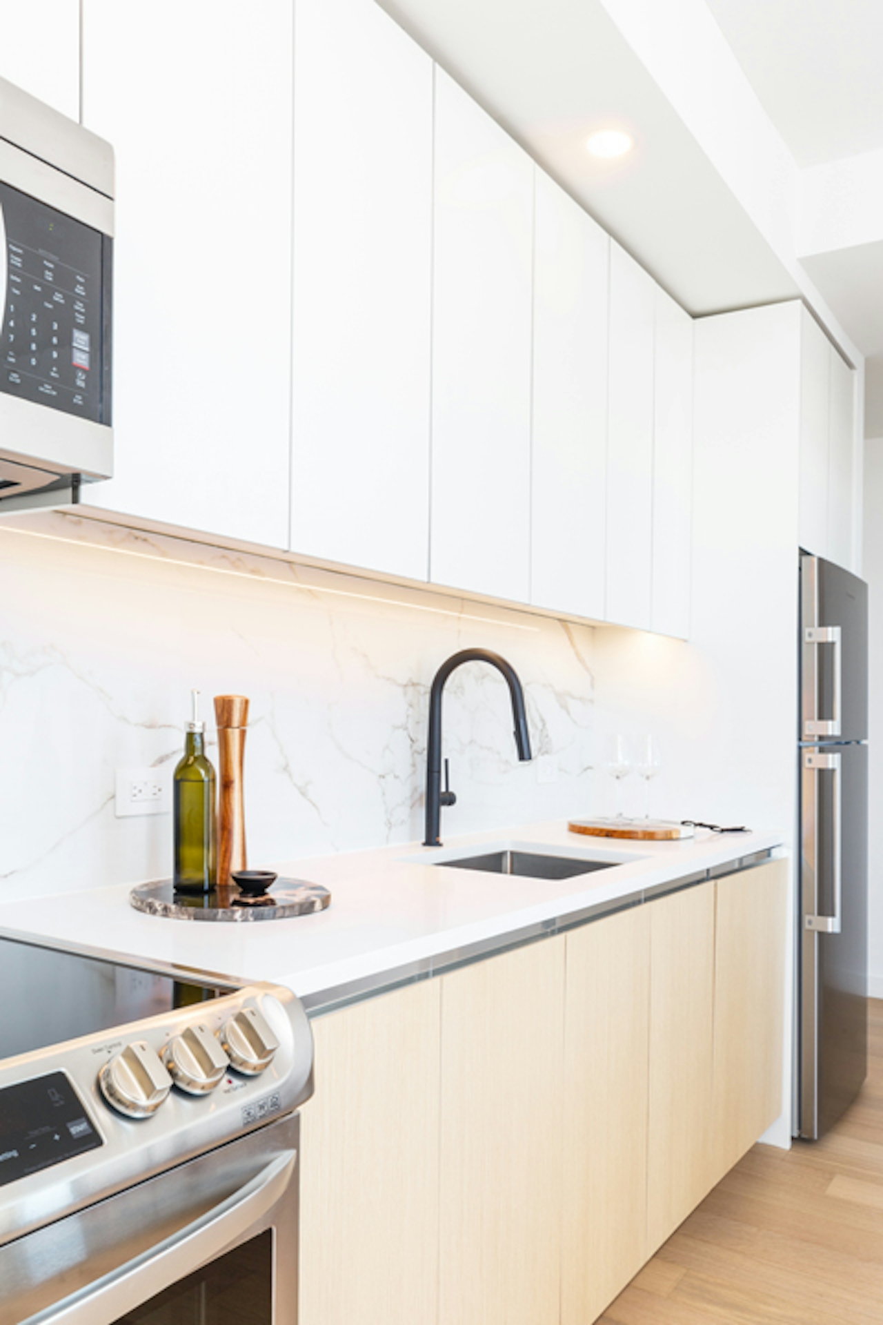 a stove top oven sitting inside of a kitchen