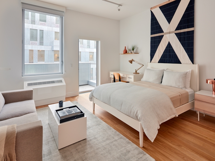 a bedroom with a large bed in a room