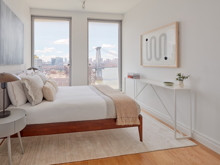 a living room filled with furniture and a large window