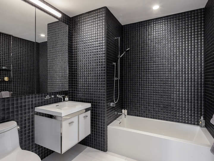 a large white tub sitting next to a sink