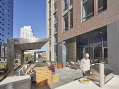 Thumbnail of The Ashland: 38N a man sitting in front of a building